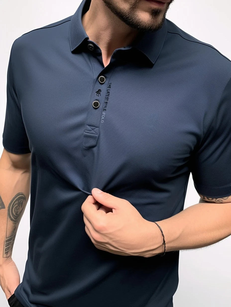 Short sleeve polo shirt in charcoal showing collar detail and relaxed silhouette