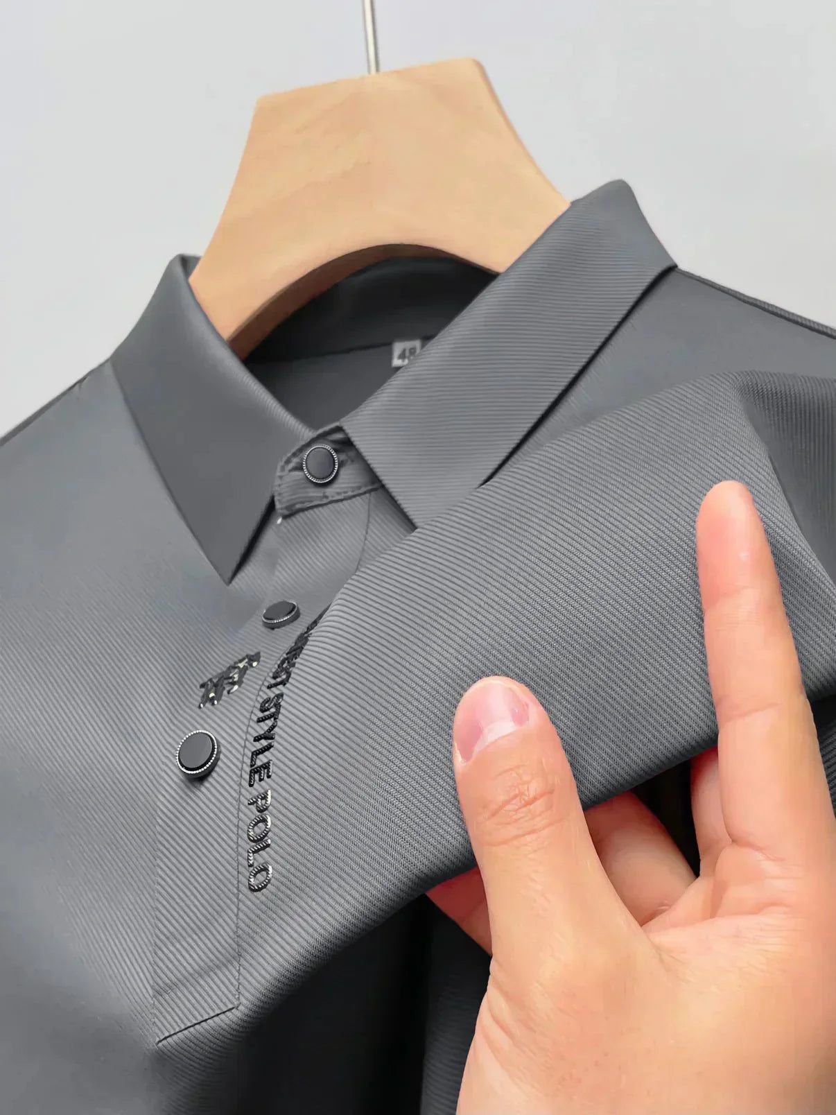 Men's polo shirt with embroidered placket detail and ribbed textured weave