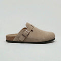 Side view of men's suede clogs in beige with adjustable buckle strap and cork footbed