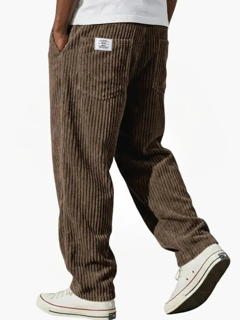 Grey ribbed corduroy trousers with functional side pockets and adjustable waist