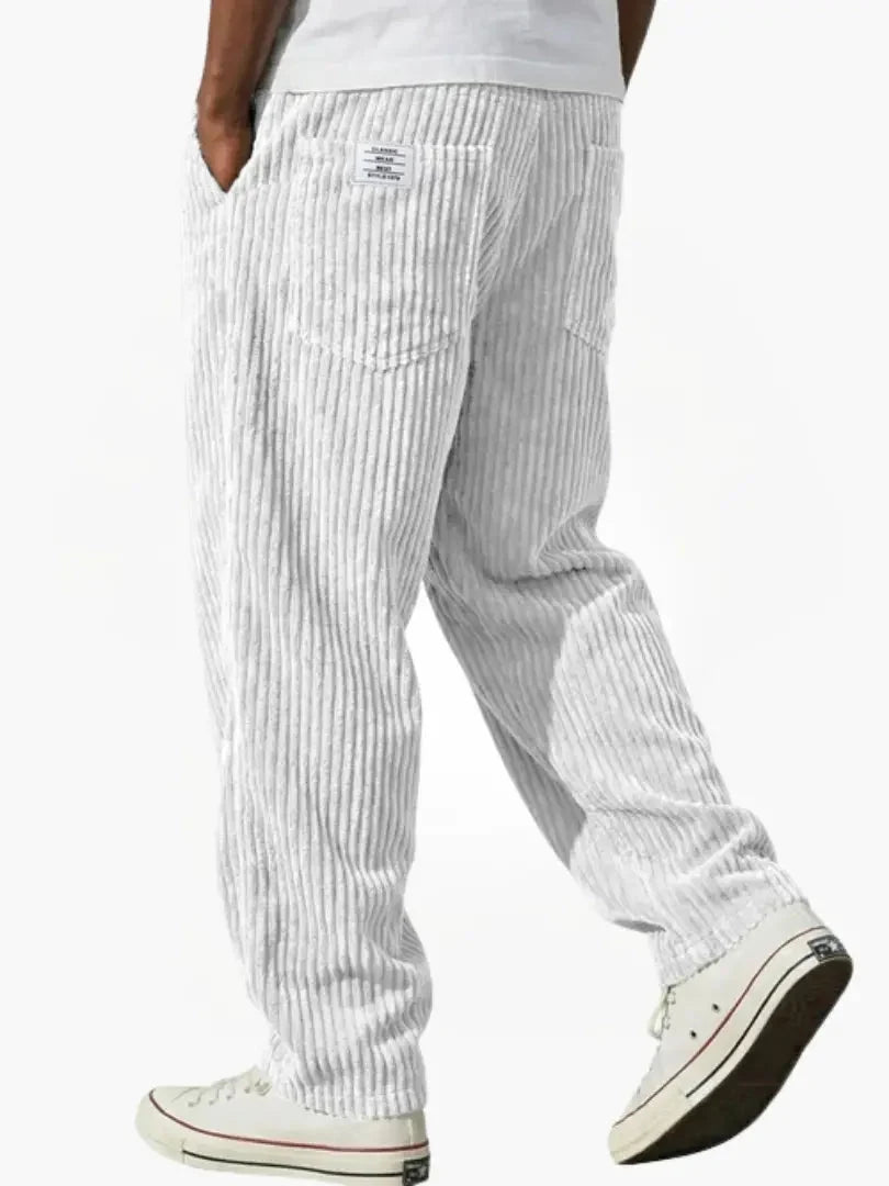 Full-length view of corduroy trousers displaying vintage-inspired ribbed texture and clean lines