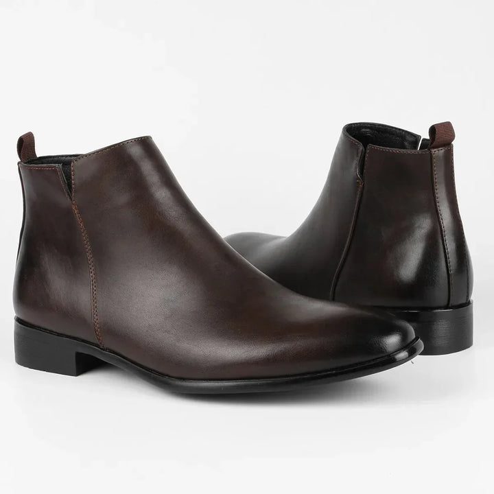 Men's Chelsea boots with structured sole and smooth finish for smart casual wear