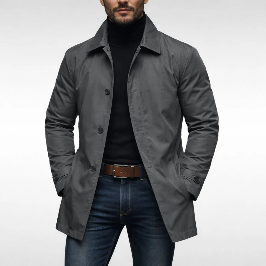 Close-up view of men's fly front coat showing button closure and structured collar detail
