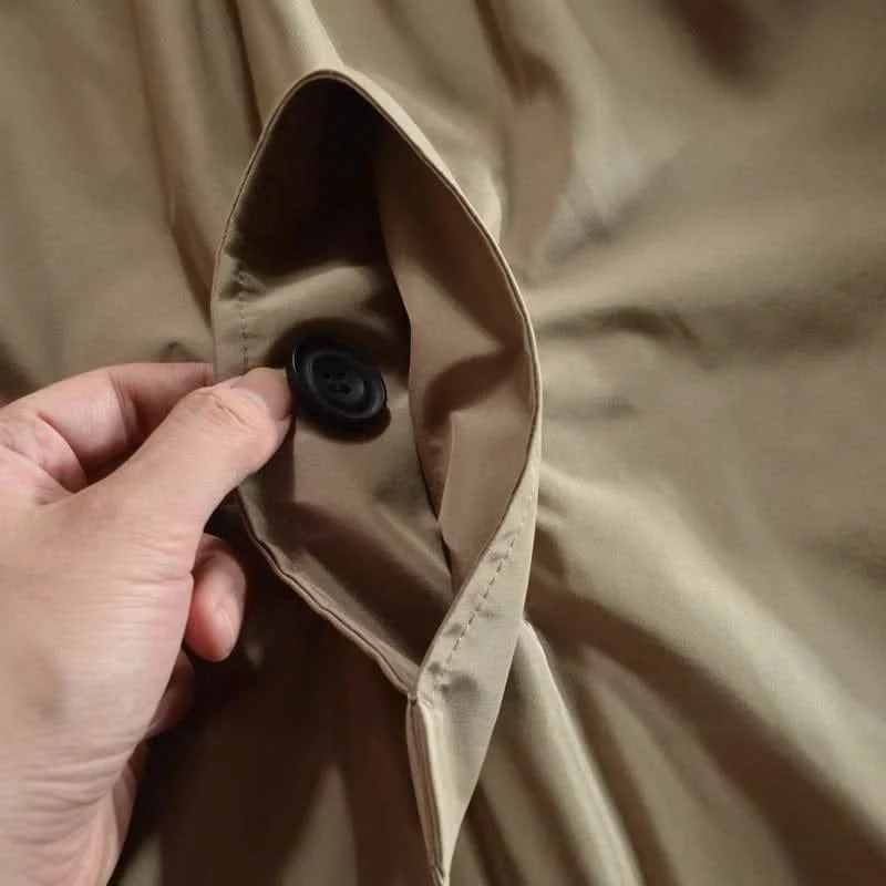 Full-length view of men's fly front coat highlighting relaxed fit and proportions
