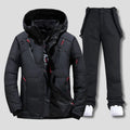 Men's ski suit set with hooded jacket and insulated trousers in charcoal grey with red zip accents
