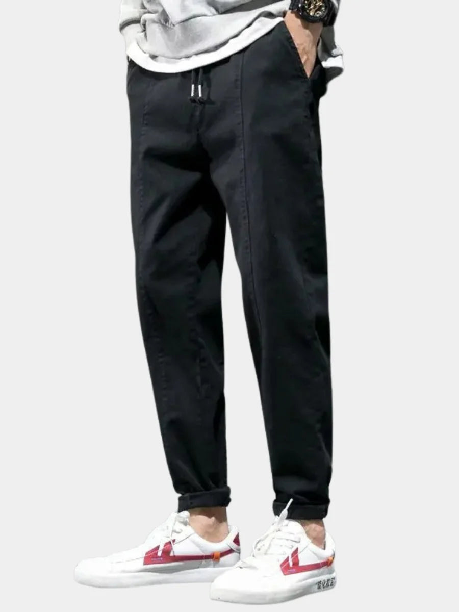 Men's tapered joggers in black with relaxed fit and adjustable drawstring waist for casual wear