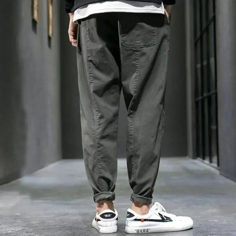 Rear view of men's tapered joggers showing structured fit and tapered leg design