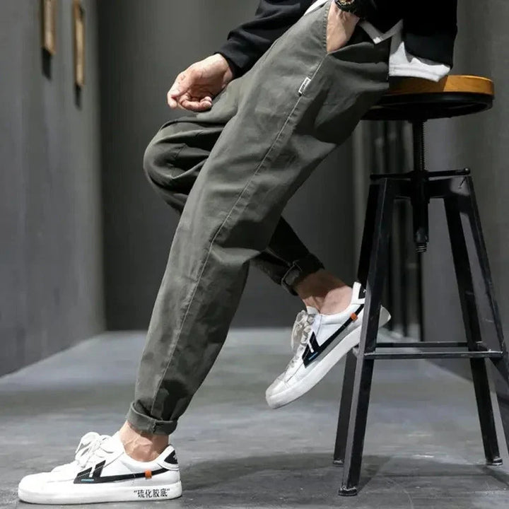 Men's tapered joggers in casual setting demonstrating ease of movement and versatile styling