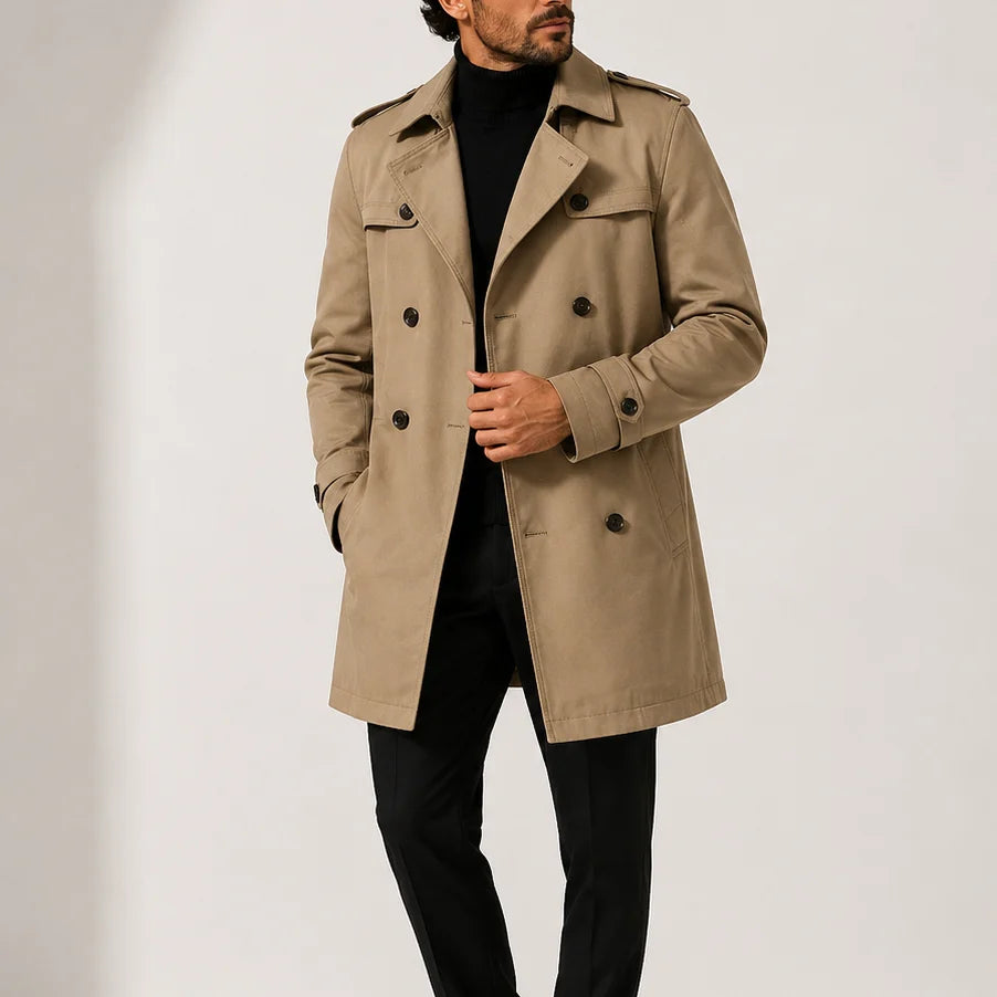 Men's trench coat in beige with double-breasted front and structured lapel collar worn over black turtleneck