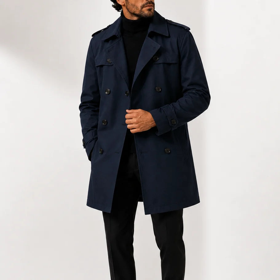 Close-up view of men's trench coat showing double-breasted button closure and shoulder epaulettes detail