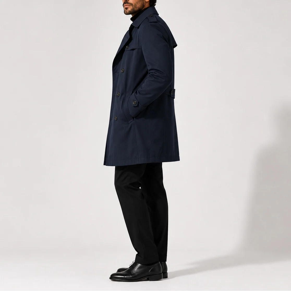 Back view of men's trench coat showing structured shoulders and classic tailored silhouette