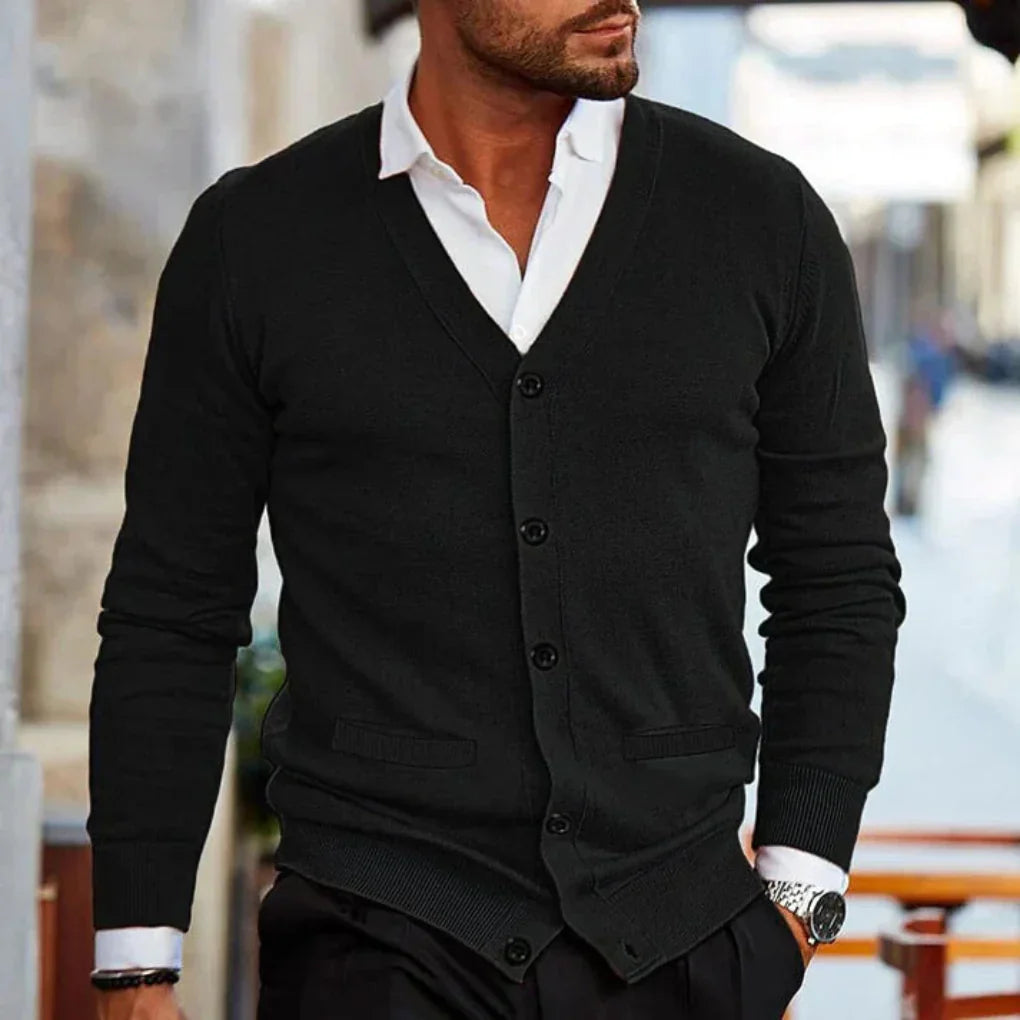 Men's button cardigan in burgundy paired with grey trousers for office-ready layered look