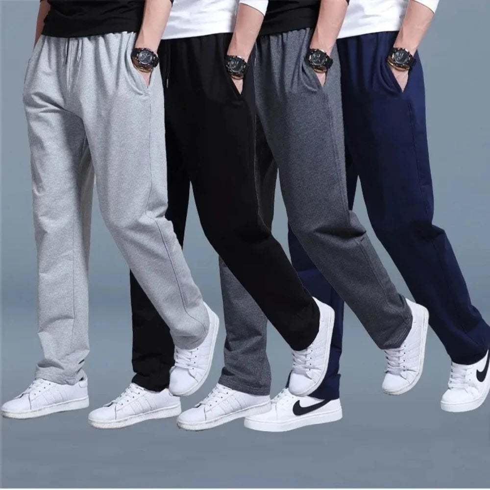 Close-up view of men's black joggers showing adjustable drawstring closure and elastic waistband detail