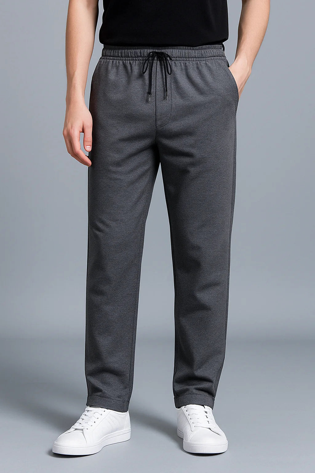 Full-length view of men's black joggers paired with white t-shirt for casual styling