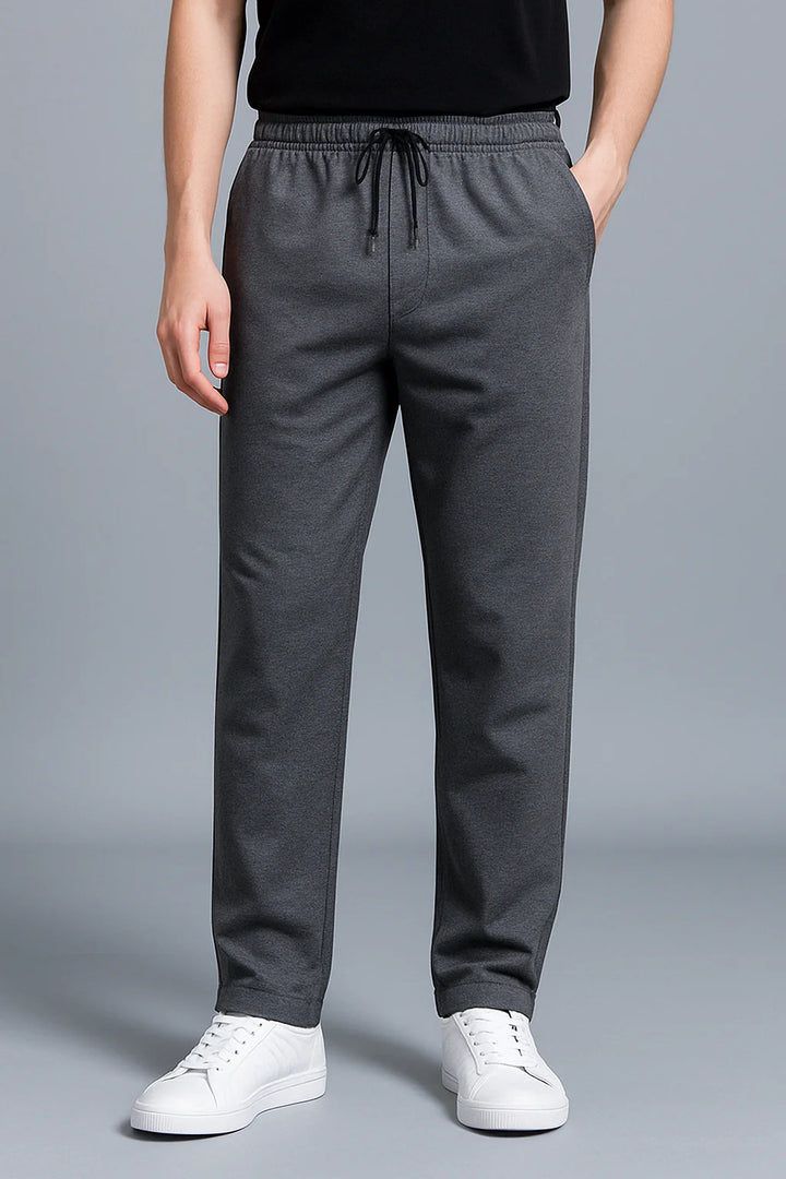 Full-length view of men's black joggers paired with white t-shirt for casual styling