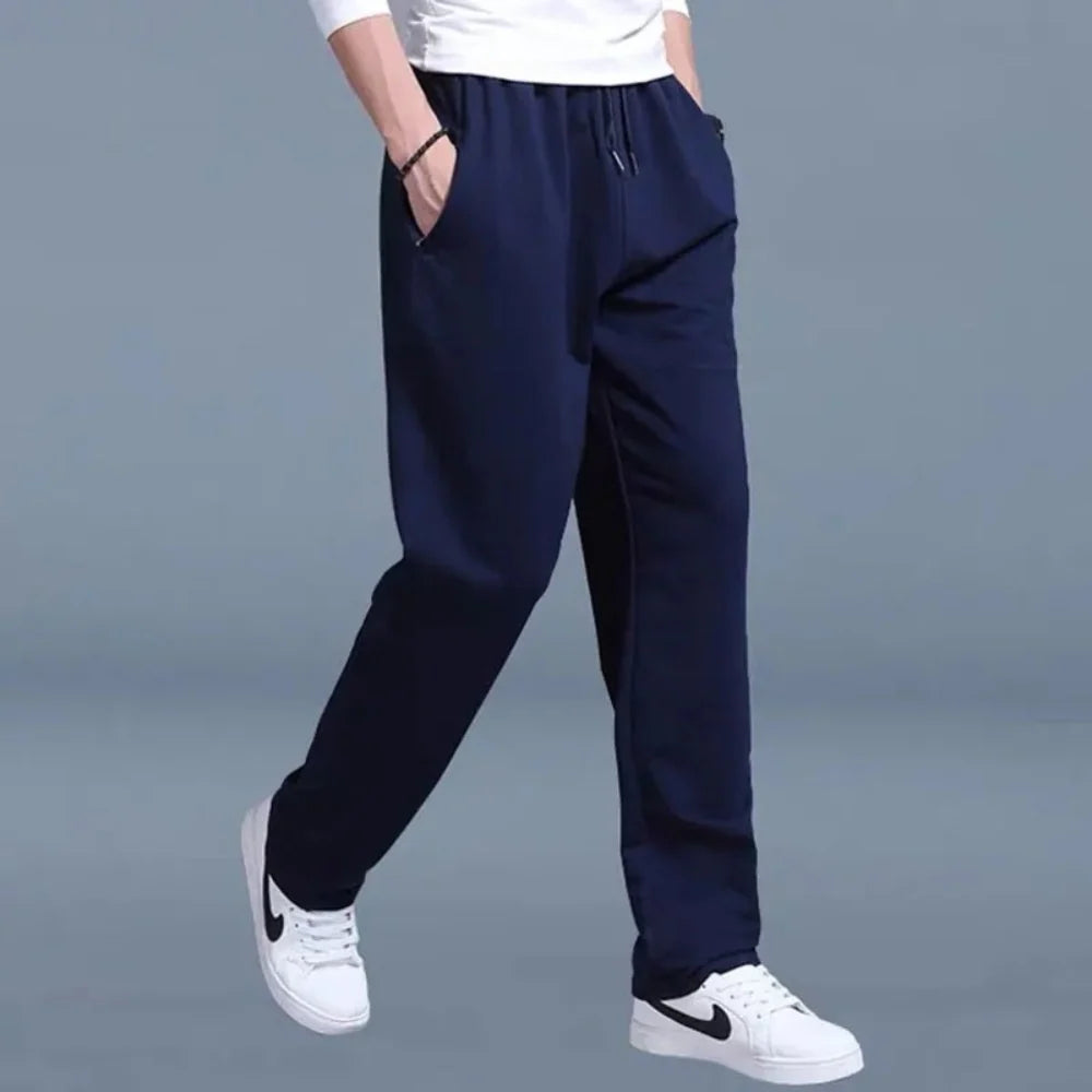 Men's joggers in black showing relaxed drape and comfortable fleece fabric construction