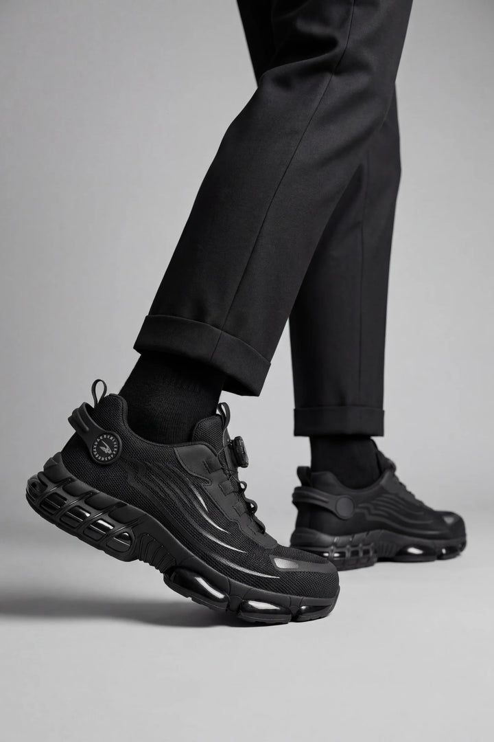 Side view of men's protective trainers with breathable mesh upper and reinforced toe cap