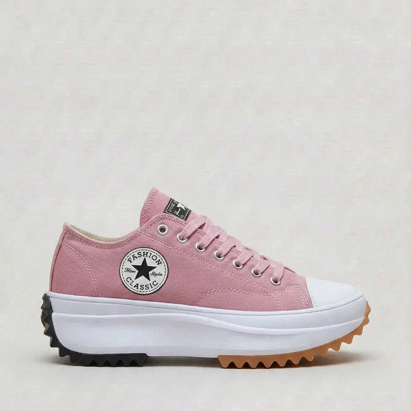 Side view of women's canvas platform trainers with raised sole and breathable upper
