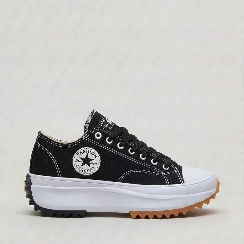 Women's canvas platform trainers in white displaying thick platform sole and secure lacing