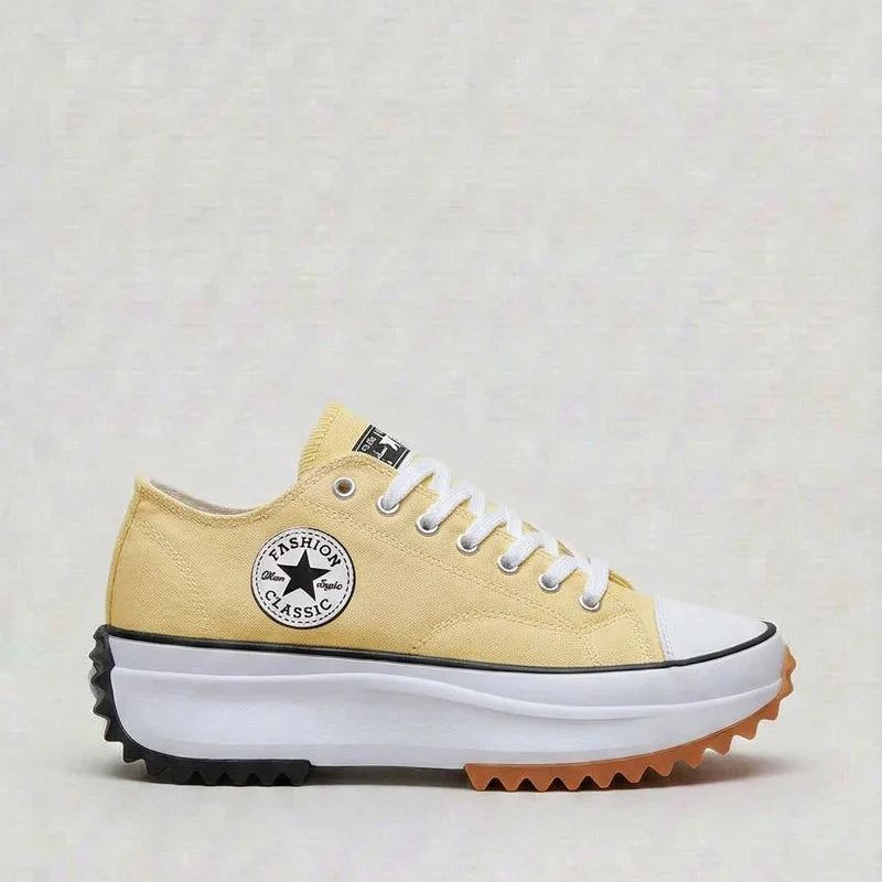 Detail shot of women's platform trainers showing canvas texture and cushioned construction