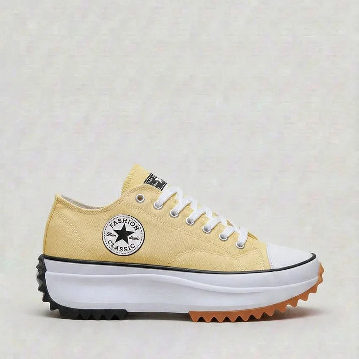 Detail shot of women's platform trainers showing canvas texture and cushioned construction