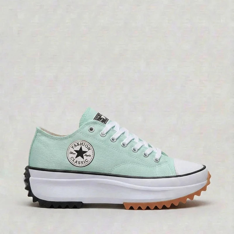 Women's canvas platform trainers styled with casual trousers for everyday wear