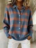Women's checked knit shirt in blue and rust tones with button-front closure and ribbed cuffs