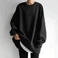 Women's oversized sweatshirt in black with crew neckline and drop shoulder design for relaxed everyday wear