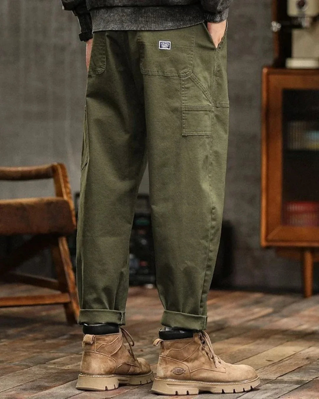 Side view of men's cargo trousers showing flap pocket detail and straight-leg silhouette