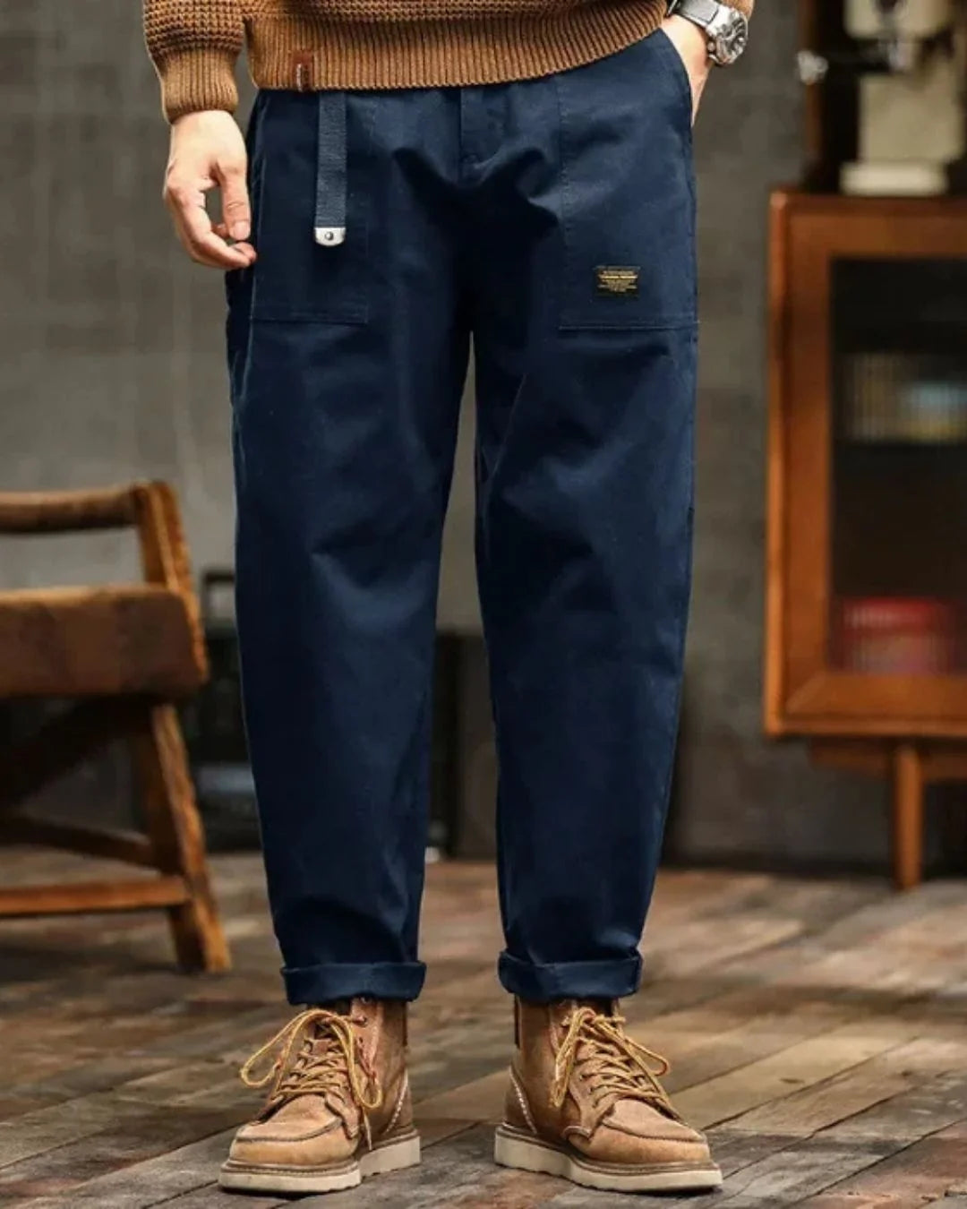 Full-length view of men's cargo trousers with relaxed fit and utility pocket design