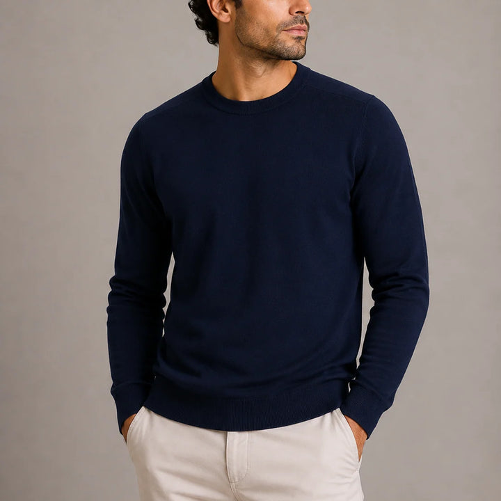 Detail shot of ribbed cuffs and hem on crew neck knit jumper