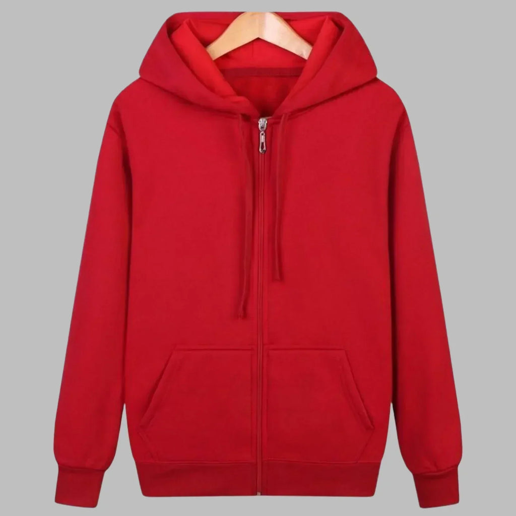Detail shot of kangaroo pocket on men's zip-up hoodie with fleece interior