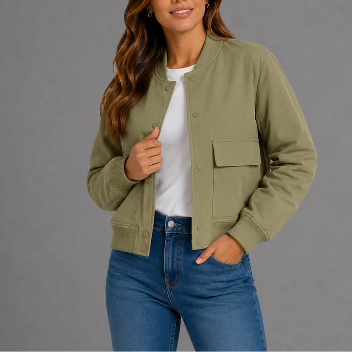 Women's bomber jacket styled casually over white tee demonstrating easy layering fit