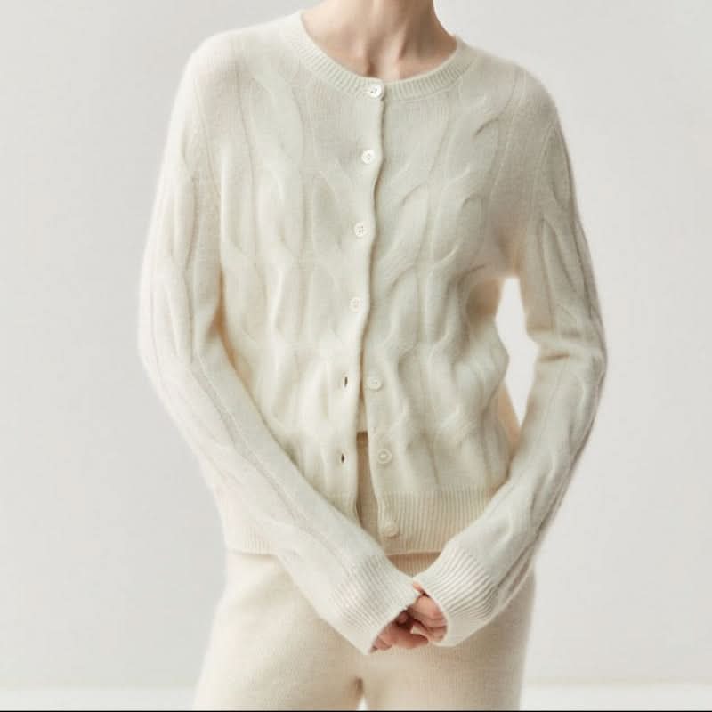 Women's cable knit cardigan in cream with button-through closure and ribbed trims on model