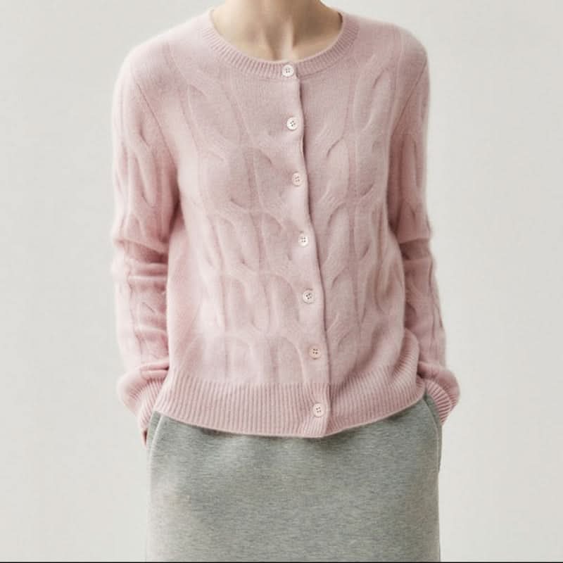 Side view of relaxed fit cable knit cardigan showing drape and sleeve length