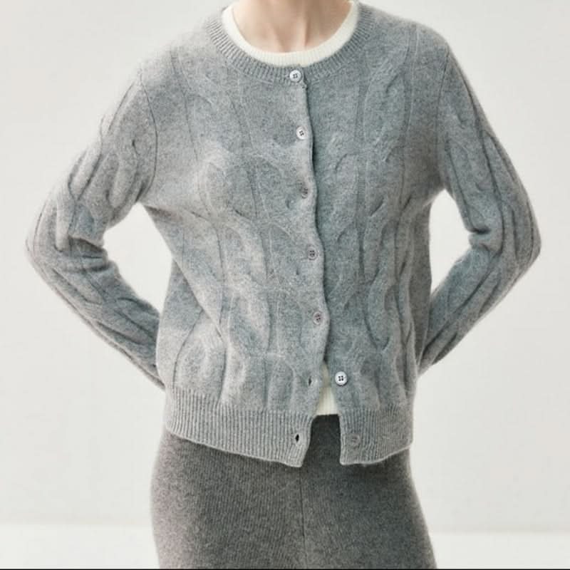 Full-length view of women's cable knit cardigan styled with matching knit trousers