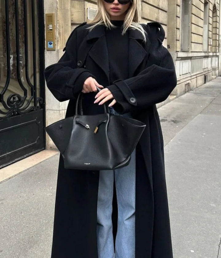 Black belted trench coat with classic double-breasted design and tailored cut