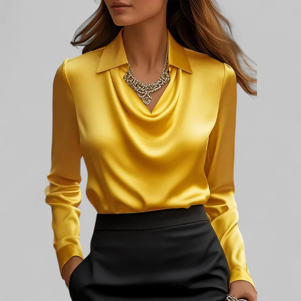 Full-length view of draped collar blouse tucked into high-waisted trousers