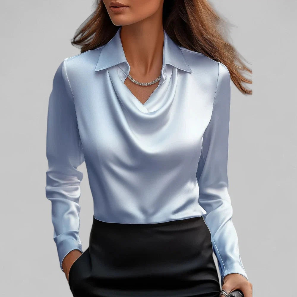 Back view of fitted blouse showing tailored silhouette and long sleeves