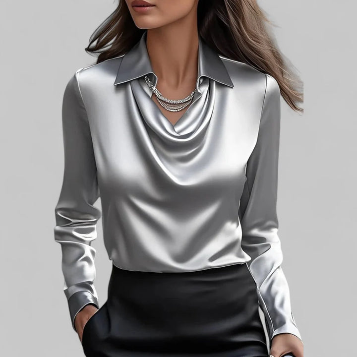 Close-up of cowl neckline drape and satin-finish fabric texture