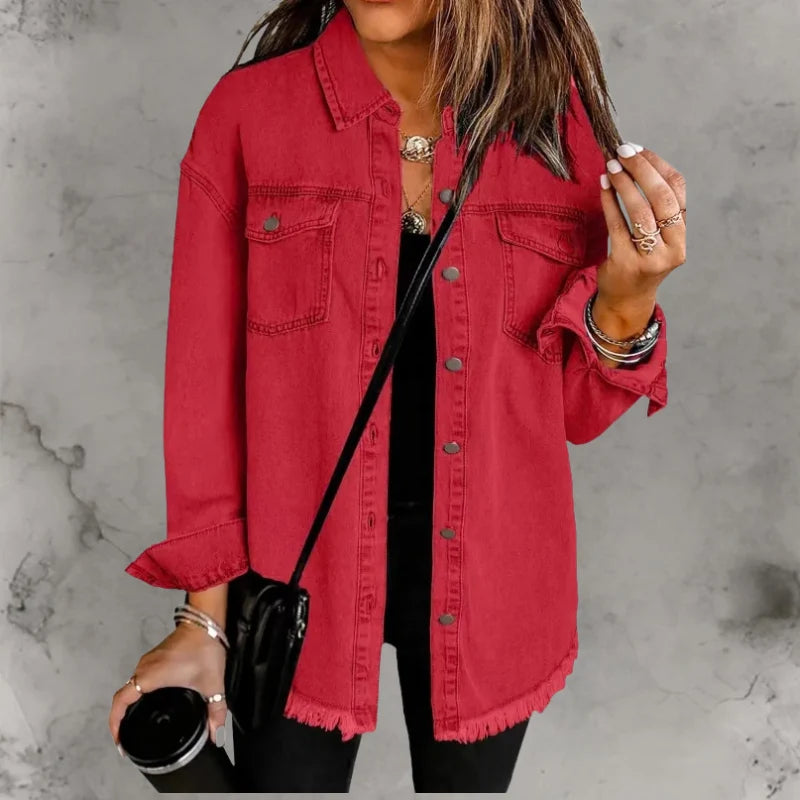 Detail of denim shacket frayed raw hem edge and medium-weight woven fabric construction