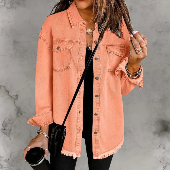 Close-up view of denim shacket collar, button closures, and chest pocket detailing
