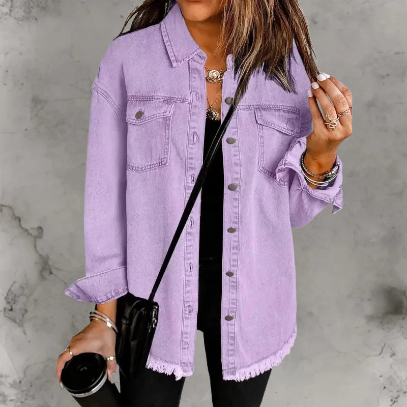 Side view of women's oversized denim shacket displaying relaxed hip-length fit and sleeve construction