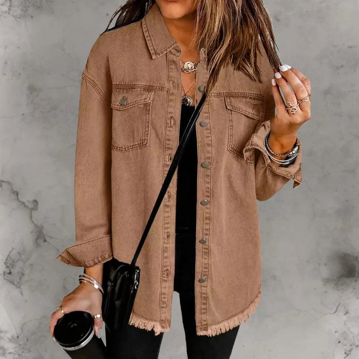 Woman wearing oversized denim shacket demonstrating relaxed fit and hip-length cut for everyday wear