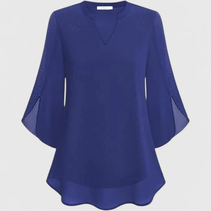 Women's black blouse styled with trousers for office or evening wear