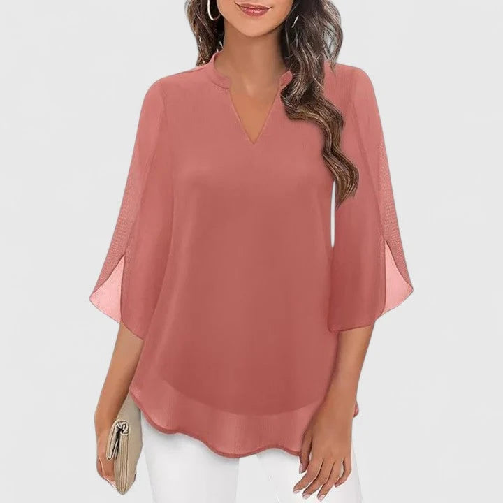 Turquoise V-neck blouse with sheer lace panels and relaxed fit