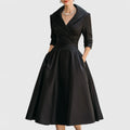 Wrap bodice midi dress with wide collar and three-quarter sleeves in structured fabric with pleated skirt