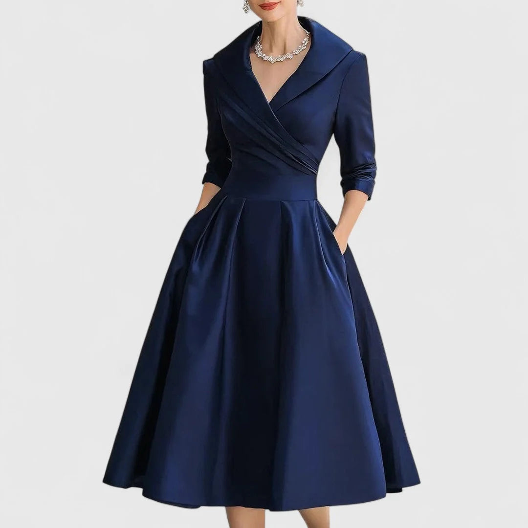 Close-up of wrap bodice midi dress collar detail and three-quarter sleeve construction