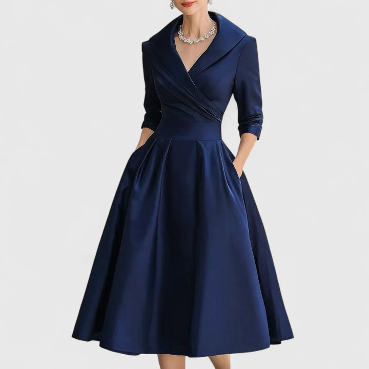 Close-up of wrap bodice midi dress collar detail and three-quarter sleeve construction