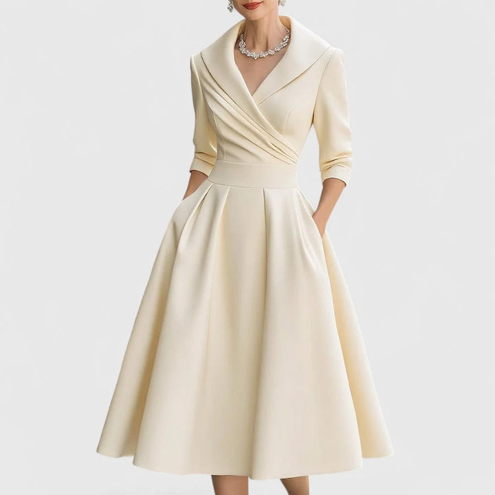 Detail shot of wrap bodice midi dress waist closure and structured fabric drape